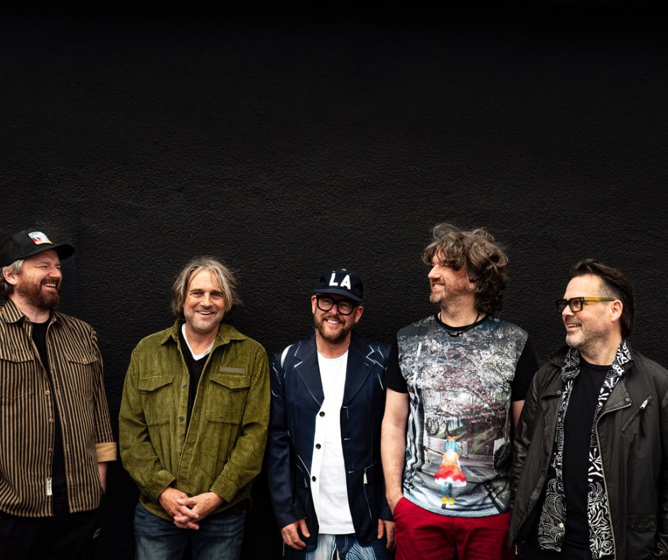 Performers at RoseShire Festival smiling against a black background.